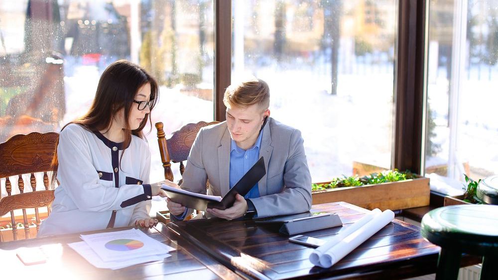 young couple looking over their rental property finances